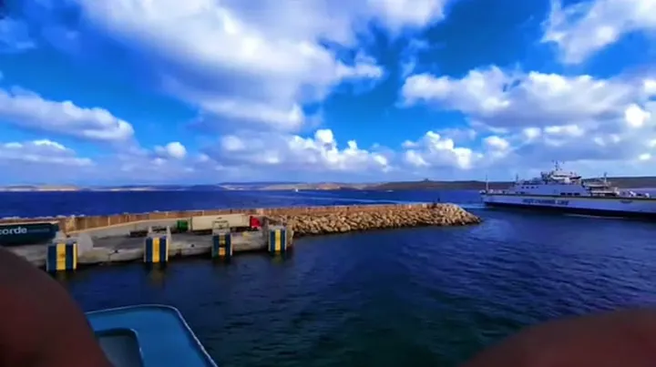 Blue sky and a harbour seen from a ferry