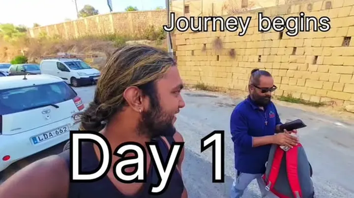 Ray walking down a sunny street, captioned Journey begins, Day 1